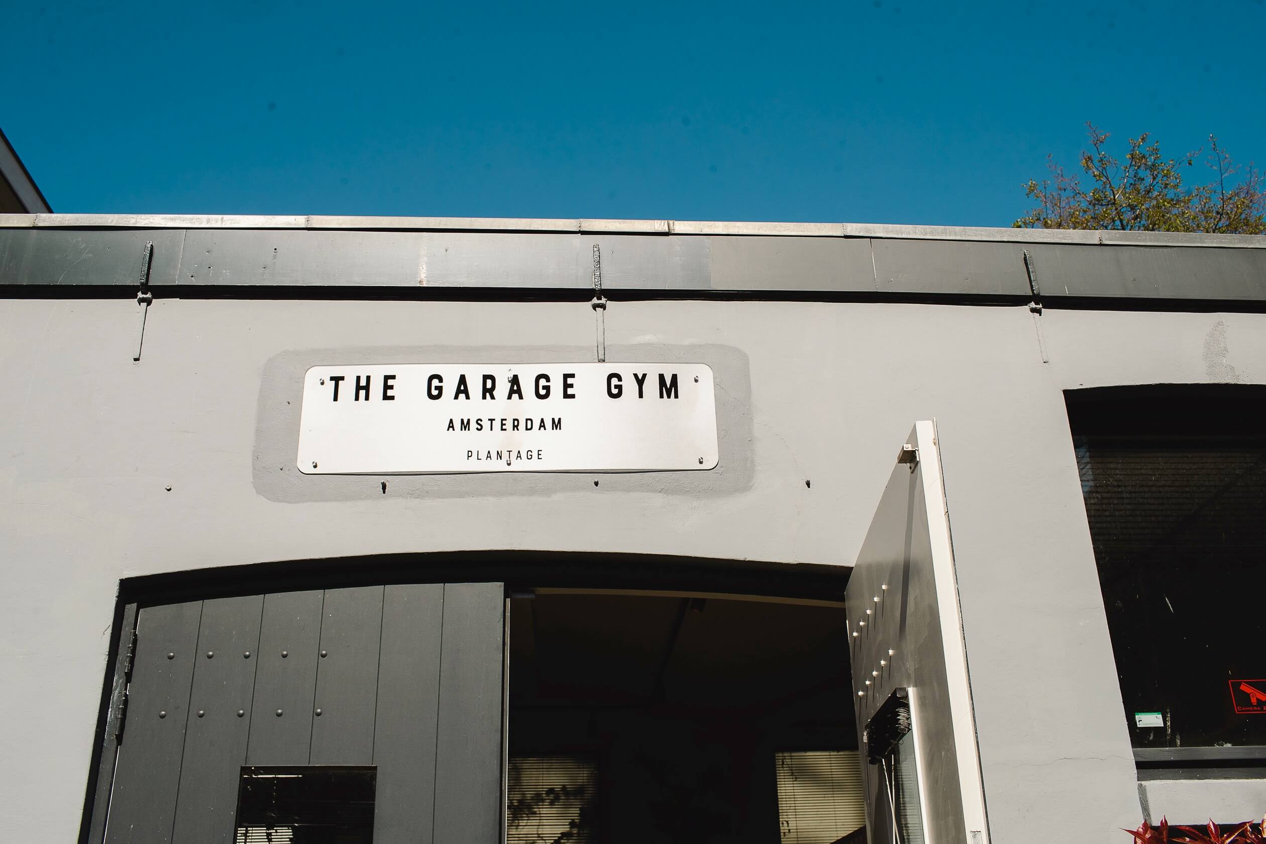 the-garage-gym-location-plantage-sign-front-door